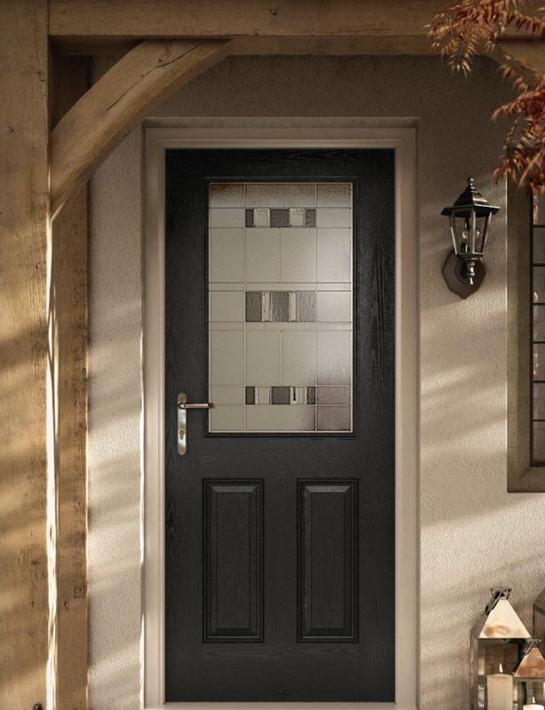 A black cottage-style composite door with square glass