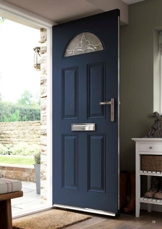 A navy composite door with an arched glass panel